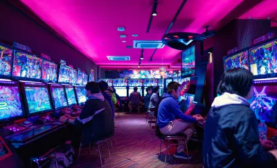 The 3 best console games of all time - listed : Gamers playing video games in an arcade games room